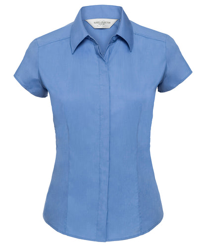 Tryck din logga på Skjortor från Russell Collection - Anpassa Damskjorta i polycotton easycare figursydd poplin med cap sleeve i färgen Mellanblå för företag, föreningar och privatpersoner