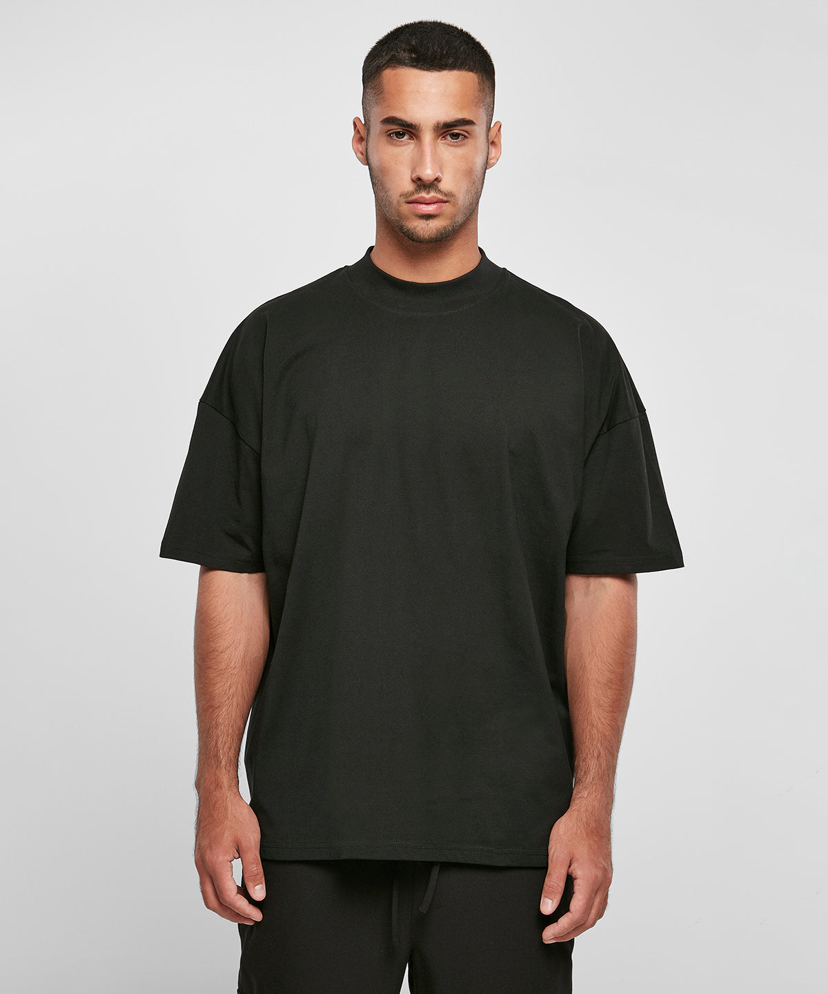 Tryck din logga på T-shirts från Build Your Brand - Anpassa Oversized High Neck T-Shirt i färgen för företag, föreningar och privatpersoner